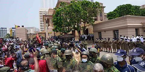 Members of the Socialist Youth Union shout slogans outside the president's office during a protest against the worst economic crisis in memory in Colombo. (Photo| AP)