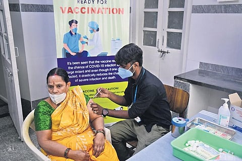 A health worker administers the Covid vaccine to a woman beneficiary at Dasappa hospital in Bengaluru on Tuesday | shriram bn