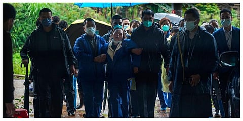A relative of passengers onboard the China Eastern Flight 5735 cries as she is escorted near the crash site, Thursday, March 24, 2022. (Photo | AP)