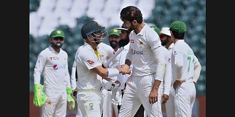 Pakistan's Shaheen Shah Afridi, center left, shakes hand with Australia's David Warner after his dismissal on the fourth day of the third test match.(Photo |AP)