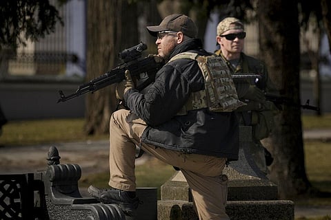 Ukrainian servicemen guard the area during a press conference by Kyiv Mayor Vitali Klitschko and his brother, former heavyweight boxing world champion Wladimir Klitschko. (Photo | AP)