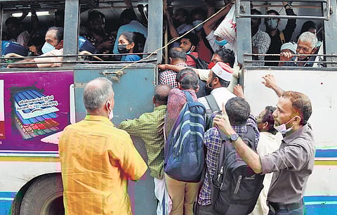 With private buses on strike, passengers try to enter a KSRTC bus at mofussil bus stand in Kozhikode on Thursday | T P Sooraj