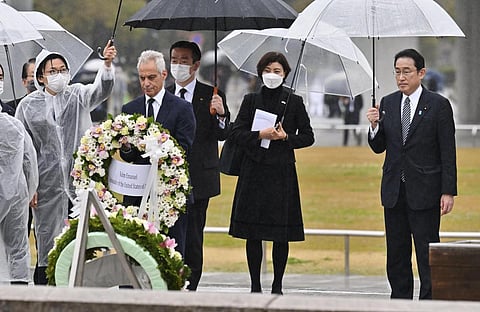 U.S. Ambassador to Japan Rahm Emanuel(CL) with Japanese Prime Minister Fumio Kishida(R) lays a wreath at the cenotaph for the atomic bombing victims at the Hiroshima Peace Memorial Park. (Photo | AP)