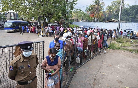 Sri Lankans wait in a queue to buy kerosene oil in Colombo, Sri Lanka, Friday, March 25, 2022. (Photo | AP)