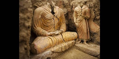 In this photograph made on Tuesday, Oct. 12, 2010 in Mes Aynak valley, south of Kabul, Afghanistan, Buddha statues are seen inside an ancient temple(File photo | AP)