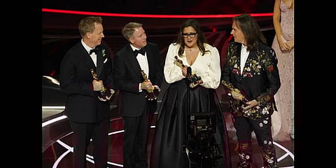 Jared Bush, from left, Clark Spencer, Yvett Merino and Byron Howard accept the award for best animated feature film for 'Encanto' at the Oscars 2022 in Los Angeles(Photo | AP)