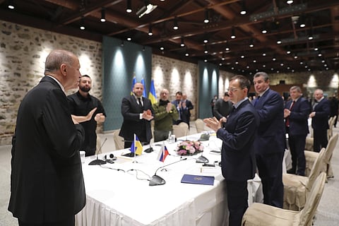 In this photo provided by Turkish Presidency, Turkish President Recep Tayyip Erdogan, right, greets the Russian and Ukrainian delegations ahead of their talks, in Istanbul, March 29, 2022. (AP)