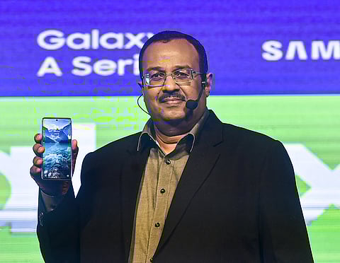 Samsung India's Senior Vice President Raju Pullan displays a newly launched smartphone model of the Samsung 'Galaxy A' series. (Photo | PTI)