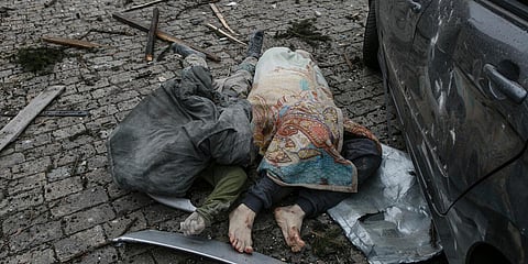 Dead bodies lie in the central square following shelling of the City Hall building in Kharkiv. (Photo| AP)