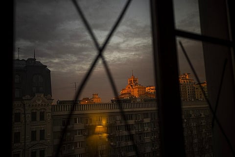 View of the sunset through windows that have been sealed to avoid the bursting of glass from possible shockwaves in central Kyiv, Ukraine. (Photo | AP)
