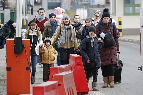 A family arrive at the border crossing in Medyka, Poland, Wednesday, March 2, 2022, after fleeing from the Ukraine. (Photo | AP)