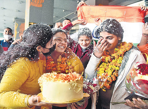 family members greet evacuated students at Delhi airport on wednesday | AFp/parveen negi