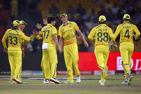 Australia's Sean Abbott, center, celebrates with teammates after taking the wicket of Pakistan's Fakhar Zaman. (Photo | AP)