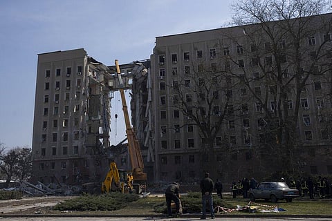 A crane operates at the regional government headquarters of Mykolaiv, Ukraine, after a Russian attack, on Wednesday, March 30, 2022(Photo | AP)