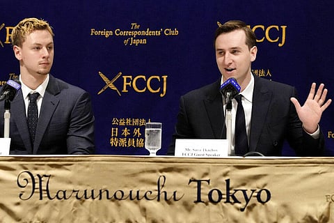Ukraine's YouTubers, Sava Tkachov, right, speaks as his young brother Yan Tkachov listens to a press conference at the Foreign Correspondents Club of Japan in Tokyo. (Photo | AP)
