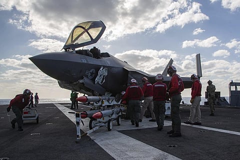 Marine Wing Fighter Attack Squadron (VMFA) 314 personnel refuel and load an F-35C Lightning II with the AIM-120 advanced medium-range air-to-air missile. (Photo | AP)