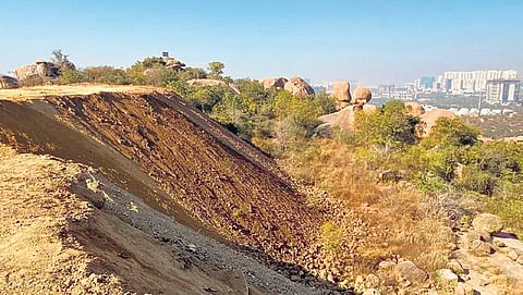 A view of the the loose soil that has covered a sizeable part of the rock formation at Khajaguda in Hyderabad  on Thursday.