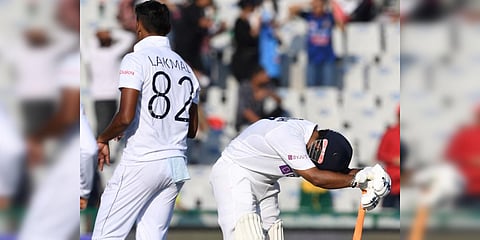 India's Rishabh Pant reacts after he was dismissed by Sri Lanka's Suranga Lakmal (L) during Day 1 of the 1st Test match at the Punjab Cricket Association Stadium in Mohali. (Photo| AFP)