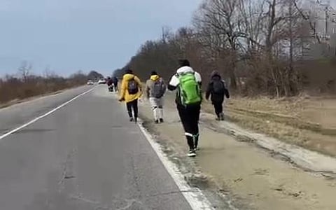 A group of Indian students of Daynlo Halytsky Medical University, Lviv, walk towards the Ukraine-Poland border for evacuation. (Photo | Twitter/ANI)