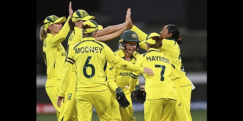 Australian players celebrate the wicket of England's Amy Jones during the ICC Women's Cricket World Cup 2022 cricket match.(Photo | AP)