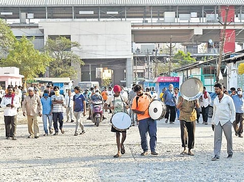 Commission agents play drums to express their joy after the High Court ordered opening of the Gaddiannaram fruit market in Hyderabad on Friday  | Vinay Madapu