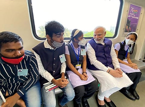 Prime Minister Narendra Modi rides in Pune Metro with the school children after inaugurating it, in Pune on Sunday. (Photo | ANI)