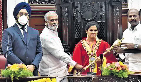 Ministers PK Sekhar Babu and Ma Subramanian hand over the sceptre to R Priya after swearing in as the city. (Photo | P Jawahar, EPS)