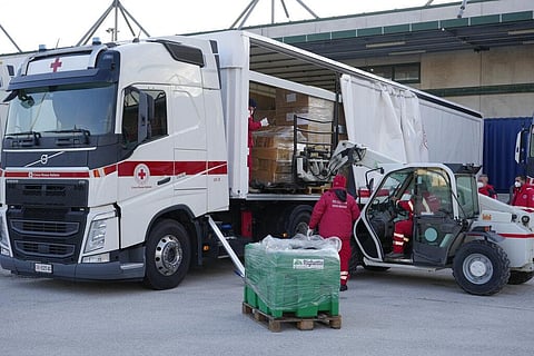 Italian Red Cross workers load a truck at the operational center in Avezzano, Italy, Monday, Feb. 28, 2022. (Photo | AP)
