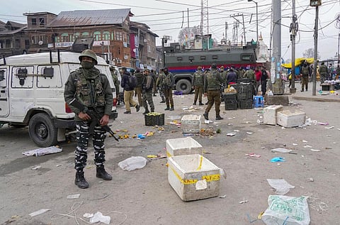 Indian soldiers and policemen guard at the site of a grenade explosion in Srinagar. (Photo | AP)