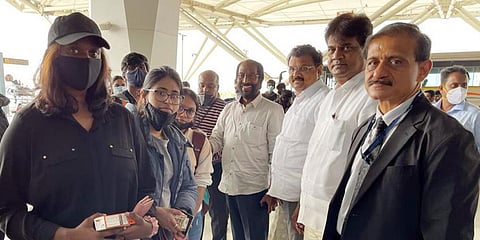 Rajya Sabha MP Tiruchy N Siva (centre), head of the TN government’s special team, with Tamil students preparing to board a special flight arranged by the State to Chennai. (Photo| EPS)