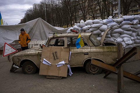 A militia man stands at a checkpoint set up on a road heading to the city of Kyiv, Ukraine, Saturday, March 5, 2022. (Photo | AP)