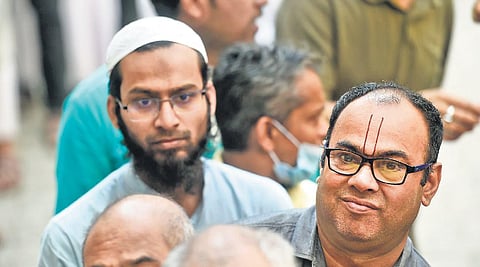 Voters at a polling booth in Varanasi on the last phase of UP polls on Monday. (Photo | PTI)