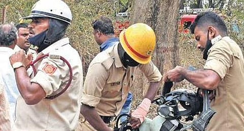 Fire personnel prepare to bring the situation under control at Vani Vilas Water Works in Mysuru on Monday 