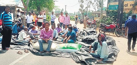 Farmers protesting over token lapse in Naugaon on Tuesday | Express