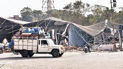A trader transports his belongings as Gaddiannaram Fruit Market is being demolished on Tuesday morning | Vinay Madapu