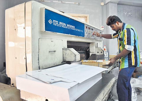 A worker at a printing unit in Coimbatore | express
