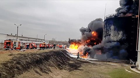 Firefighters work at the site of fire at an oil depot in Belgorod region, Russia. (Photo | Russian Emergency Ministry Press Service via AP)