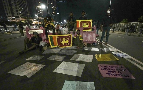 Sri Lankans protestors spend the night outside the president's office in Colombo, Sri Lanka, Saturday, April 9, 2022. (Photo | AP)