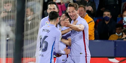 Barcelona's Luuk de Jong (R) celebrates after scoring his side's third goal during a La Liga soccer match between Levante and Barcelona at the Ciutat de Valencia stadium in Valencia. (Photo | AP)