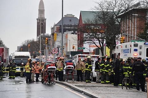 Members of the New York Police Department and emergency vehicles crowd the streets after shooting at a subway station in New York. (Photo | AFP)