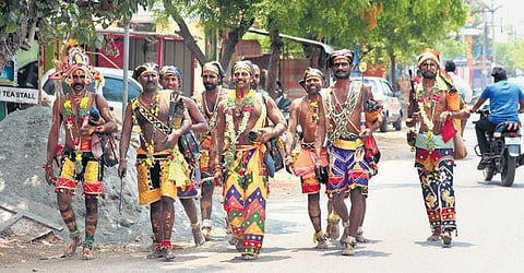 File photo of seer padham thangigal carrying the palanquin of Kallazhagar; devotees dressed as Kallazhagar seeking offerings from public | k k sundar