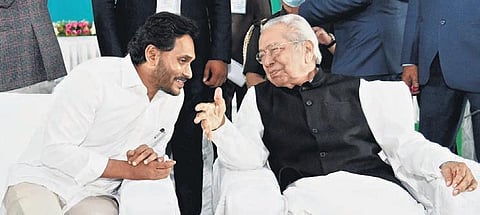 Governor Biswa Bhusan Harichandan and CM YS Jagan Mohan Reddy during the swearing-in ceremony of the new cabinet at the Secretariat in Velagapudi on Monday. As many as 25 ministers were administered t