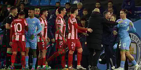 Manchester City's Jack Grealish (R) argues with Atletico Madrid's Angel Correa (L) during the Champions League, first leg, quarterfinal match at the Etihad Stadium, in Manchester. (Photo | AP)
