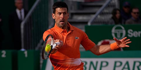 Novak Djokovic returns the ball to Alejandro Davidovich Fokina during their second round match at the Monte-Carlo Masters tennis tournament. (Photo | AP)