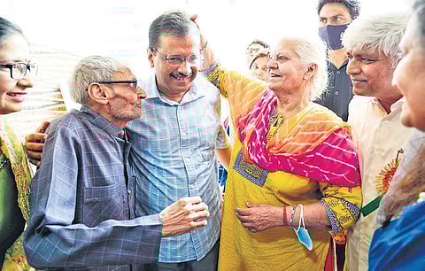 Delhi Chief Minister Arvind Kejriwal with some of the senior citizens. ( Photo | EPS)