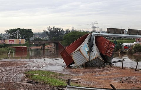 Shipping containers carried away and left in a jumbled pile by floods in Durban, South Africa. ( Photo | AP)