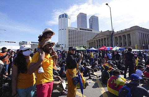 Sri Lankans welcome the dawn of Sinhalese and Tamil new year at a protest site near the president's office in Colombo, Sri Lanka, Thursday, April 14, 2022. (Photo | AP)