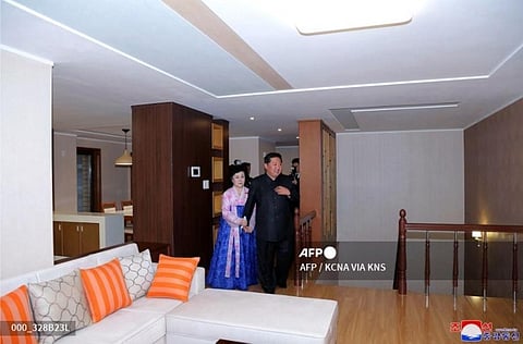 North Korean leader Kim Jong Un and veteran North Korean news anchor Ri Chun Hi (L) visiting a hous in Pyongyang.(Photo | AFP)