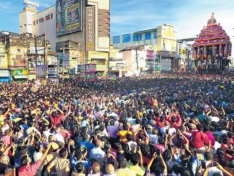 Devotees throng the Madurai Meenakshi Sundareswarar Temple and pull the massive car during the Chithirai Car Festival in Madurai on Friday | KK Sundar