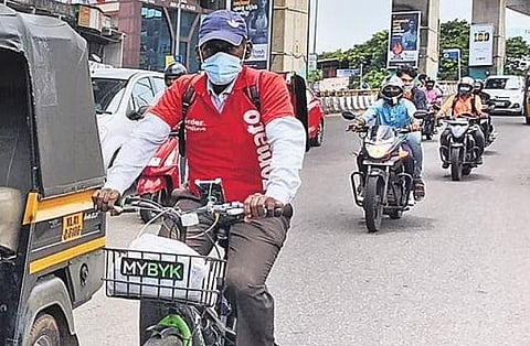 Vasudev, a native of Andhra Pradesh, delivering food on his bicycle | Arun Angela